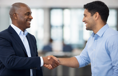 Employer and employee handshake representing staffing services